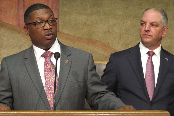 FILE - Transportation and Development Secretary Shawn Wilson, left, speaks about proposed surplus spending on roadwork as Louisiana Gov. John Bel Edwards listens, March 28, 2018, in Baton Rouge, La. Candidate registration opened Tuesday, Aug. 8, 2023, for Louisiana’s highly anticipated Oct. 14 election where there will be five vacant state office positions without an incumbent on the ballot, including the governor. Wilson qualified for the governor's race. (AP Photo/Melinda Deslatte, File)
