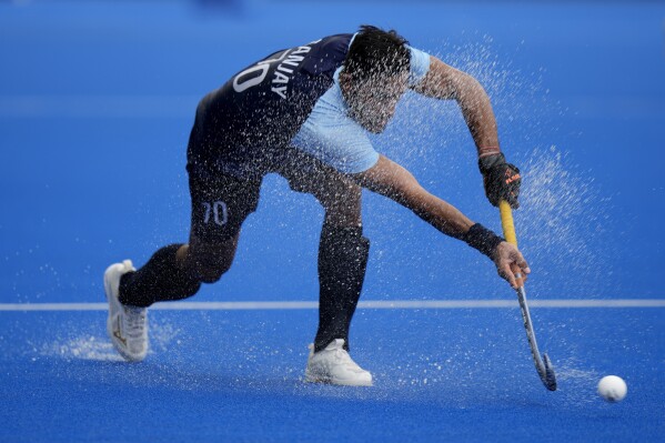 India's Sanjay passes the ball during the preliminary men's Pool A hockey match between Singapore and India at the Gongshu Canal Park Stadium in the 19th Asian Games in Hangzhou, China, Tuesday, Sept. 26, 2023. (AP Photo/Aijaz Rahi)