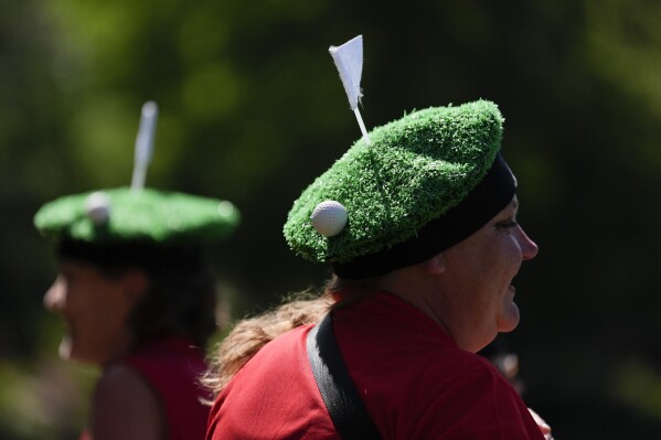 Patrons watch during a practice round in preparation for the Masters golf tournament at Augusta National Golf Club Monday, April 8, 2024, in Augusta, Ga. (AP Photo/Ashley Landis)