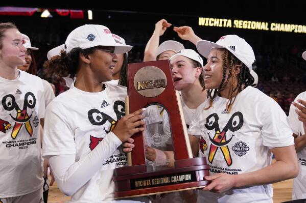 Louisville players celebrate after beating Michigan 62-50 in a college basketball game in the Elite 8 round of the NCAA women's tournament Monday, March 28, 2022, in Wichita, Kan. (AP Photo/Jeff Roberson)