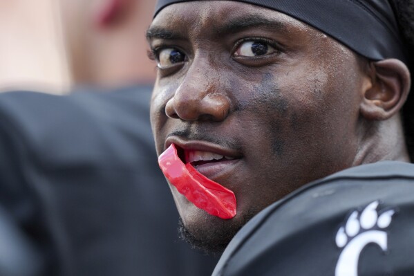 Cincinnati quarterback Emory Jones stands on the sideline during the second half of an NCAA college football game against Eastern Kentucky, Saturday, Sept. 2, 2023, in Cincinnati. (AP Photo/Aaron Doster)