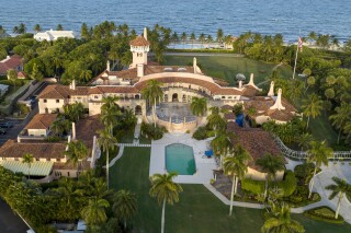 FILE - An aerial view of President Donald Trump's Mar-a-Lago estate is seen Wednesday, Aug. 10, 2022, in Palm Beach, Fla. Social media users are sharing a satirical post about a bank foreclosing on Mar-a-Lago club as real. (AP Photo/Steve Helber)