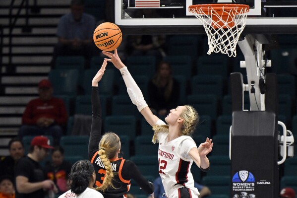 FILE - Stanford forward Cameron Brink (22) blocks a shot by Oregon State guard Dominika Paurova (3) during the second half of an NCAA college basketball game in the semifinal round of the Pac-12 tournament Friday, March 8, 2024, in Las Vegas. Brink selected to The Associated Press All-America women’s NCAA college basketball first team, Wednesday, March 20, 2024. (AP Photo/David Becker, File)