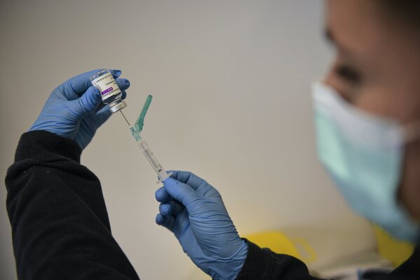 A health worker prepares a dose of the Astrazeneca vaccine during a COVID-19 vaccination campaign in Pamplona, northern Spain, Saturday, April 3, 2021. The Navarra regional government on Saturday called for around 3.000 residents of the city to be vaccinated against COVID-19. (AP Photo/Alvaro Barrientos)