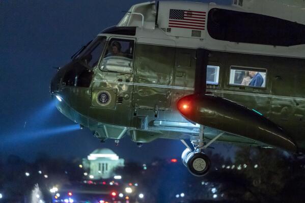 Marine One, with President Joe Biden in the window, approaches for landing on the South Lawn of the White House, Thursday, Feb. 9, 2023, in Washington. Biden is returning from Florida. (AP Photo/Alex Brandon)