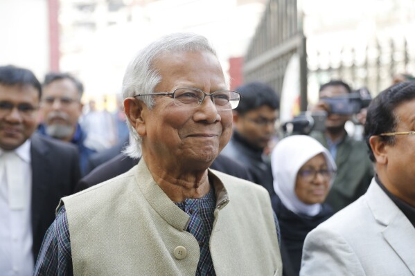 Nobel Peace Prize winner, Muhammad Yunus, smiles as he arrives to appear before a labor court in Dhaka, Bangladesh, Sunday, Jan. 28, 2024. (AP Photo/Mahmud Hossain Opu)
