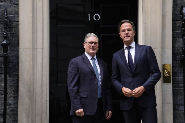Britain's Prime Minister Sir Keir Starmer, left, welcomes Nato Secretary General Mark Rutte to Downing Street in London, Monday, June 9, 2025. (Jordan Pettitt/PA via AP)