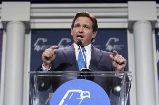 FILE - Florida Gov. Ron DeSantis speaks on Nov. 19, 2022, in Las Vegas. Gov. DeSantis said Tuesday, Dec. 13, 2022 that he plans to petition the state's Supreme Court to convene a grand jury to investigate “any and all wrongdoing” with respect to the COVID-19 vaccines. (AP Photo/John Locher, File)