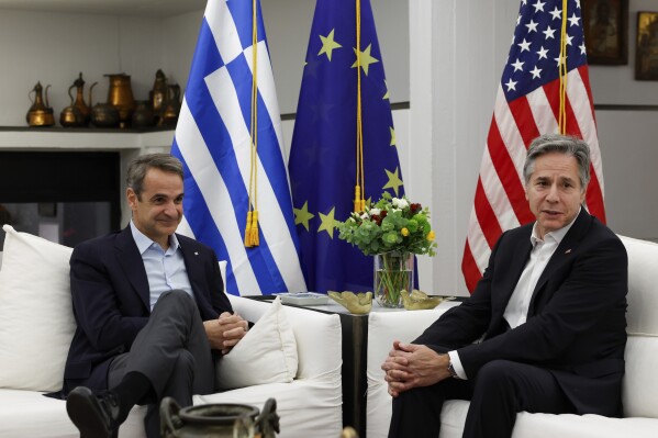 U.S. Secretary of State Antony Blinken, right, meets with Greek Prime Minister Kyriakos Mitsotakis, left, at the Prime Minister's Residence in Crete, Greece, Saturday, Jan. 6, 2024 during his week-long trip aimed at calming tensions across the Middle East. (Evelyn Hockstein/Pool Photo via AP)