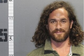 This booking photo provided by Western Tidewater Regional Jail shows Eduardo Nicolas Alvear Gonzalez. Authorities say Gonzalez is seen wearing American flag pants and allegedly smoking marijuana during the U.S. Capitol riot was arrested in Virginia. Gonzalez is scheduled for a remote hearing Friday, Feb. 12, 2021 in U.S. District Court in Norfolk. He faces several charges related to his alleged participation at the insurrection on Jan. 6. (Western Tidewater Regional Jail via AP)