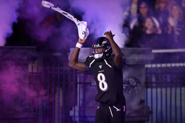Baltimore Ravens quarterback Lamar Jackson is introduced onto the field prior to an NFL football game against the New York Jets, Thursday, Dec. 12, 2019, in Baltimore. (AP Photo/Nick Wass)