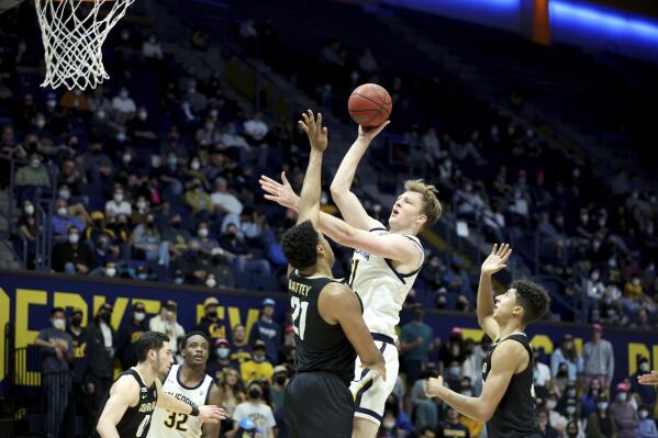 California forward Lars Thiemann, second from right, shoots against Colorado forward Evan Battey, third from right, during the second half of an NCAA college basketball game in Berkeley, Calif., Thursday, Feb. 17, 2022. (AP Photo/Jed Jacobsohn)