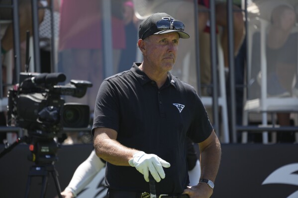 Phil Mickelson prepares to tee off the first hole during the final round of the Bedminster Invitational LIV Golf tournament in Bedminster, N.J., Sunday, Aug. 13, 2023. (AP Photo/Seth Wenig)