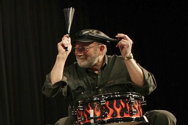 FILE - Jerry J.I. Allison performs in Clear Lake, Iowa, on Jan. 30, 2009, to honor the 50-year anniversary of a crash that claimed the life of rock 'n' roll legends Buddy Holly, J.P. "The Big Bopper" Richardson and Ritchie Valens, in February 1959. Allison, who played and co-wrote songs with rock pioneer and childhood friend Buddy Holly and whose future wife inspired the classic “Peggy Sue,” has died. He was 82. (Teresa Prince/Globe-Gazette via AP, File)