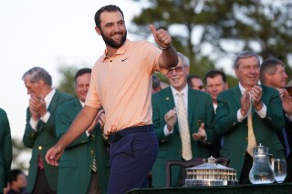 FILE - Scottie Scheffler arrives for the green jacket ceremony after winning the Masters golf tournament at Augusta National Golf Club on April 14, 2024, in Augusta, Ga. Scheffler goes for the second leg of the Grand Slam at the PGA Championship on May 16-19, 2024, in Louisville, Ky. (AP Photo/Matt Slocum, File)
