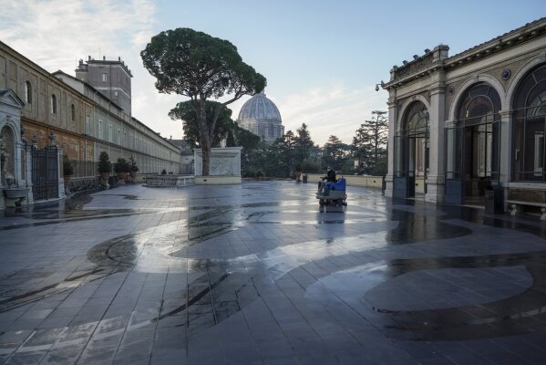 A Vatican Museum worker drives a cleaning machine on a terrace of the Vatican Museums as they prepare to open, at the Vatican, Monday, Feb. 1, 2021. . The Vatican Museums reopened Monday to visitors after 88 days of shutdown following COVID-19 containment measures. (AP Photo/Andrew Medichini)