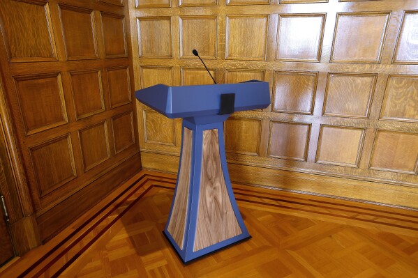 FILE - The lectern purchased by the Gov. Sarah Huckabee Sanders administration in June 2023 sits in a corner in the Governor's Conference Room at the state Capitol, Sept. 26, 2023, in Little Rock, Ark. Auditors are nearly done looking into the $19,000 lectern purchased for Gov. Huckabee Sanders and expect to issue a report on it by the end of next month, a state official told lawmakers on Thursday, Feb. 8, 2024. (Thomas Metthe/Arkansas Democrat-Gazette via AP, File)