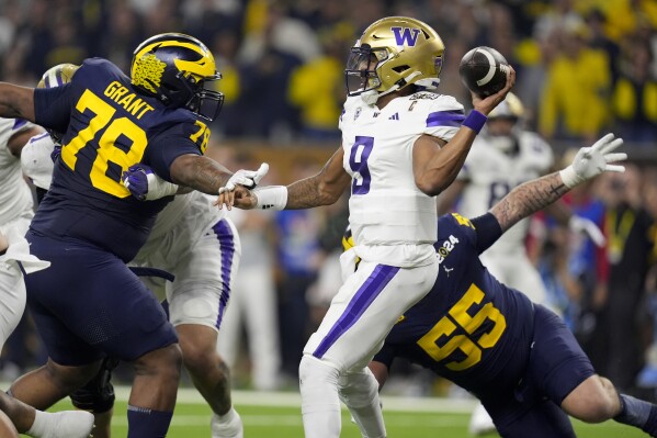 Washington quarterback Michael Penix Jr. passes against Michigan during the first half of the national championship NCAA College Football Playoff game Monday, Jan. 8, 2024, in Houston. (AP Photo/Eric Gay)