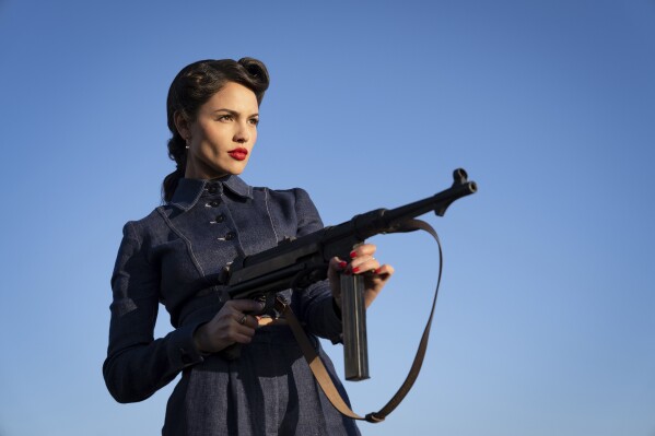 This image released by Lionsgate shows Eiza Gonzalez in a scene from the film "The Ministry of Ungentlemanly Warfare." (Daniel Smith/Lionsgate via AP)