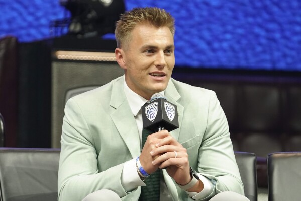 FILE - Oregon quarterback Bo Nix speaks at an NCAA college football Pac-12 media day Friday, July 21, 2023, in Las Vegas. Oregon opens their season at home against Portland State on Sept. 2. (AP Photo/Lucas Peltier, File)
