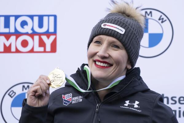 First placed Kaillie Humphries from the USA stands on the podium during the award ceremony for the women's monobob Bobsleigh World Cup race in Altenberg, Germany, Saturday, Jan. 14, 2023. (Sebastian Kahnert/dpa via AP)