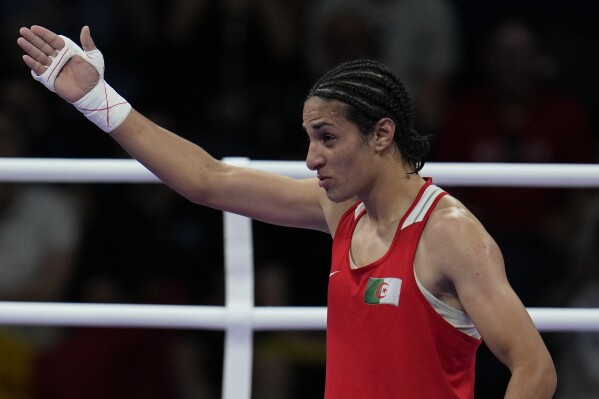 Algeria's Imane Khelif, celebrates after defeating Hungary's Anna Hamori in their women's 66kg quarterfinal boxing match at the 2024 Summer Olympics, Saturday, Aug. 3, 2024, in Paris, France. (AP Photo/John Locher)