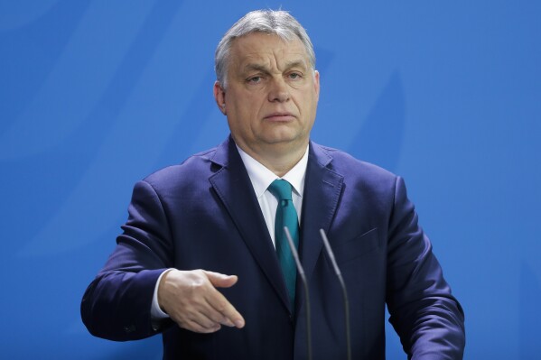 FILE - Hungary's Prime Minister Victor Orban briefs the media in Berlin, Germany, on Feb. 10, 2020. The Hungarian parliament has refused a proposal to hold a vote on Sweden’s bid to join NATO, further delaying the Nordic country’s inclusion in the military alliance. The delay on Tuesday comes as Hungary remains the main hurdle to Sweden’s admission into NATO after Turkish President Recep Tayyip Erdogan submitted a protocol to Turkey’s parliament on Monday to approve its admission. All 31 allies must endorse the accession. (AP Photo/Markus Schreiber, File )