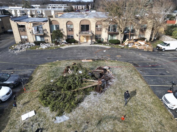 An apartment complex shows roof and structural damage after overnight storms, Wednesday, February 28, 2024, in Mundelein, Illinois. (Stacey Wescott/Chicago Tribune via AP)