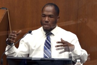 FILE - In this image from video, witness Donald Williams answers questions as Hennepin County Judge Peter Cahill presides Monday, March 29, 2021, in the trial of former Minneapolis police officer Derek Chauvin, in the May 25, 2020, death of George Floyd at the Hennepin County Courthouse in Minneapolis, Minn. The Minneapolis City Council has approved a $150,000 settlement with Williams, on Thursday, April 25, 2024, who says he suffers from post-traumatic stress disorder because of how police treated him. (Court TV via AP, Pool, File)