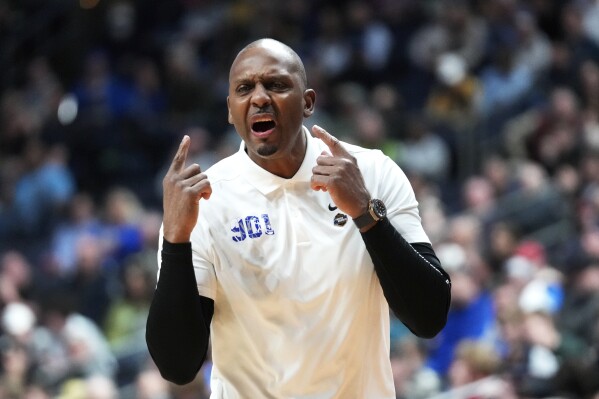 FILE - Memphis head coach Penny Hardaway argues a call against Florida Atlantic in the first half of a first-round college basketball game in the NCAA Tournament Friday, March 17, 2023, in Columbus, Ohio. An NCAA infractions panel has imposed a three-game suspension on Memphis coach Penny Hardaway for recruiting violations tied to two in-home visits with a prospect two years ago. The panel issued its ruling Wednesday, June 21.(AP Photo/Paul Sancya, File)