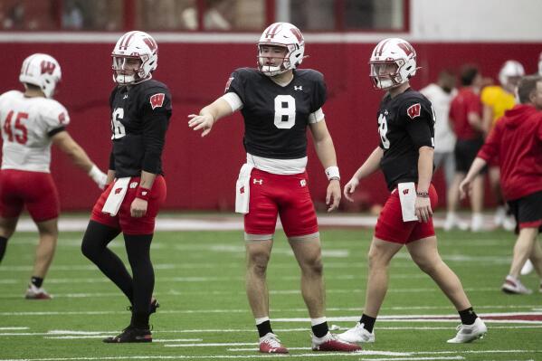 Wisconsin quarterbacks Myles Burkett (16), Tanner Mordecai (8) and Braedyn Locke (18) participate during spring NCAA college football practice at the McClain Center in Madison, Wis., Thursday, March 30, 2023. (Samantha Madar/Wisconsin State Journal via AP)