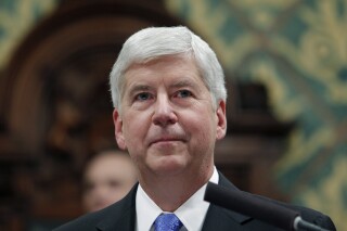 FILE - Michigan Gov. Rick Snyder delivers his State of the State address at the state Capitol, Jan. 23, 2018, in Lansing, Mich. On Monday, Dec. 11, 2023, a judge formally dismissed misdemeanor charges against the former Michigan governor in the Flint water scandal and ordered that police records and a booking photo be destroyed. (AP Photo/Al Goldis, File)