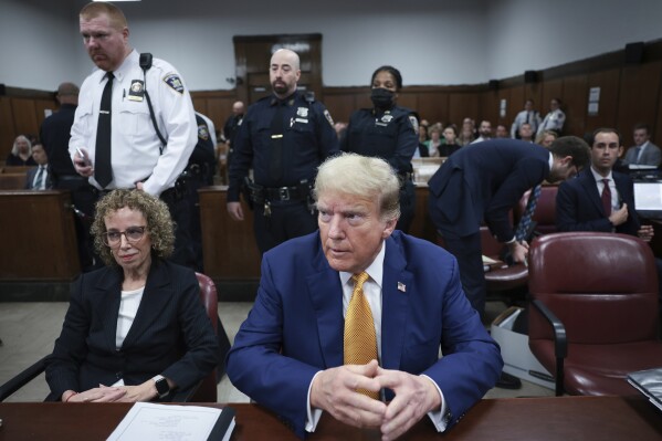 Former President Donald Trump, center, and attorney Susan Necheles, left, attend his trial at Manhattan criminal court on Tuesday, May 7, 2024, in New York. (Win McNamee/Pool Photo via AP)
