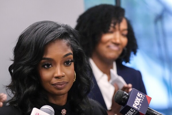 FILE - Arian Simone, left, and Ayana Parsons, right, of the Fearless Fund, attend a news conference, Aug. 10, 2023, in New York. Foundations and major donors aren't just watching court cases like the Supreme Court’s June decision ending affirmative action at universities, the ongoing lawsuit against a grant program aimed at supporting Black women entrepreneurs, and other legal challenges targeting corporate diversity programs. They are mobilizing to respond. One battleground will be the lawsuit challenging grants from the Fearless Fund, which awarded $20,000 to businesses that are at least 51% owned by Black women, among other requirements. (AP Photo/Frank Franklin II, File)
