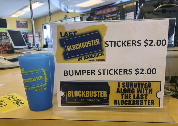 
              A sign advertising locally made souvenirs from the last Blockbuster store on the planet sits in the store in Bend, Ore., in this Tuesday, March 12, 2019 photo. When a Blockbuster in Perth, Australia, shuts its doors for the last time on March 31, the store in Bend, Ore., will be the only one left on Earth, and most likely in the universe. (AP Photo/Gillian Flaccus)
            