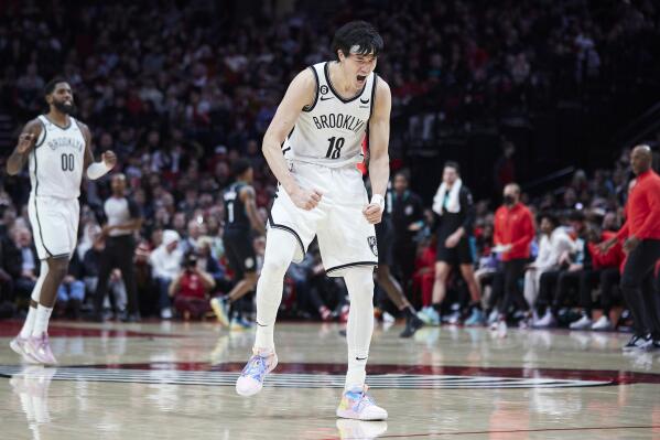 Brooklyn Nets forward Yuta Watanabe reacts after making a 3-point basket against the Portland Trail Blazers during the second half of an NBA basketball game in Portland, Ore., Thursday, Nov. 17, 2022. (AP Photo/Craig Mitchelldyer)