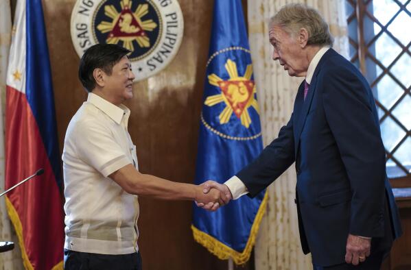 In this photo provided by the Malacanang Presidential Photographers Division, Philippine President Philippine President Ferdinand Marcos Jr., left, greets U.S. Sen. Edward Markey during the latter's courtesy call at the Malacanang presidential palace in Manila, Philippines on Thursday Aug. 18, 2022. Markey, who was once banned in the Philippines by former President Rodrigo Duterte, on Friday met a long-detained Filipino opposition leader, former senator Leila de Lima, whom he says has been wrongfully imprisoned under Duterte and should be freed. (Malacanang Presidential Photographers Division via AP)