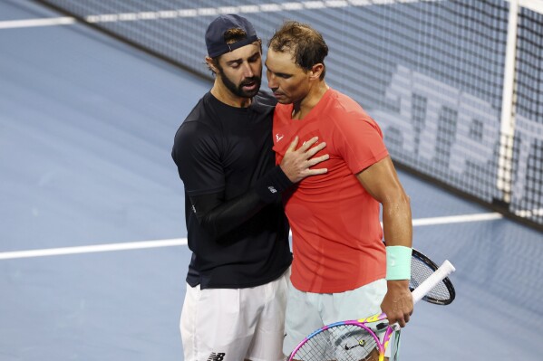 Jordan Thompson of Australia shakes hands with Rafael Nadal of Spain after he won his quarter-final match 5-7, 7-6, 6-3, during the Brisbane International tennis tournament in Brisbane, Australia, Friday, Jan. 5, 2024. (AP Photo/Tertius Pickard)