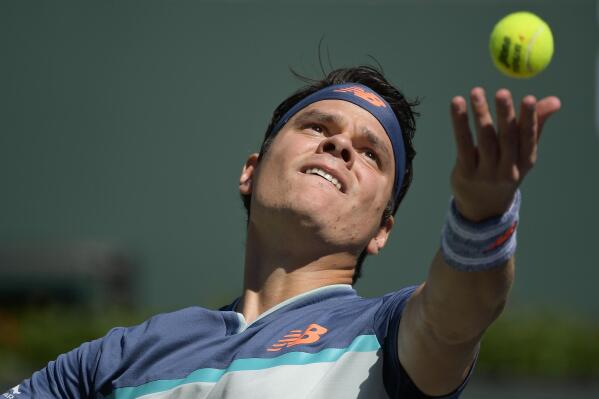 Milos Raonic, of Canada, serves to Miomir Kecmanovic, of Serbia, at the BNP Paribas Open tennis tournament Thursday, March 14, 2019, in Indian Wells, Calif. (AP Photo/Mark J. Terrill)