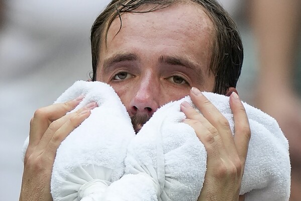 Daniil Medvedev, of Russia, cools off between games against Andrey Rublev, of Russia, during the quarterfinals of the U.S. Open tennis championships, Wednesday, Sept. 6, 2023, in New York. (AP Photo/Seth Wenig)