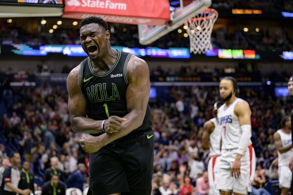 New Orleans Pelicans forward Zion Williamson (1) reacts after a basket against Los Angeles Clippers guard Amir Coffey (7) during the second half of an NBA basketball game in New Orleans, Friday, March 15, 2024. (AP Photo/Matthew Hinton)