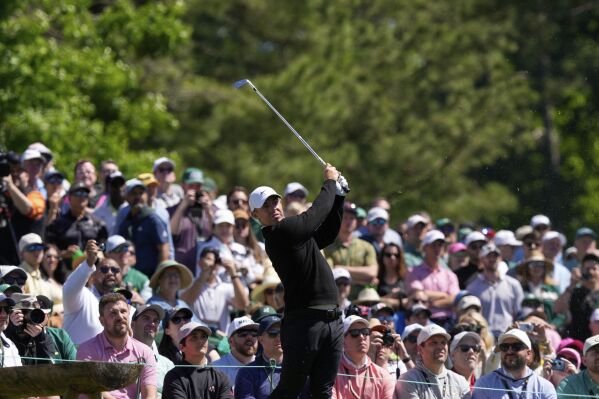 Rory McIlroy, of Northern Ireland, hits from the 12th tee during a practice round at the Masters golf tournament, Tuesday, April 8, 2025, in Augusta, Ga. (AP Photo/Matt Slocum)