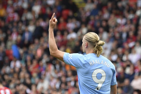 Manchester City's Erling Haaland celebrates after scoring his side's opening goal during the English Premier League soccer match between Sheffield United and Manchester City at Bramall Lane in Sheffield, England, Sunday, Aug. 27, 2023. (AP Photo/Rui Vieira)