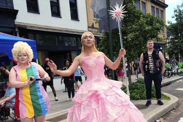Attendees pose before the World Pride parade, Saturday, June 7, 2025, in Washington. (AP Photo/Julia Demaree Nikhinson)