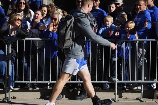 Injured Kentucky quarterback Will Levis greets fans before an NCAA college football game against South Carolina in Lexington, Ky., Saturday, Oct. 8, 2022. (AP Photo/Michael Clubb)