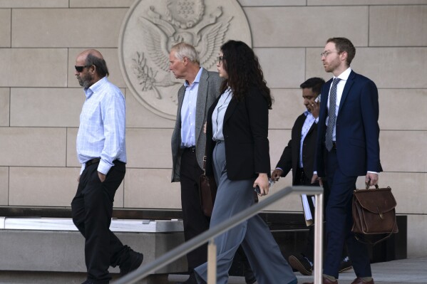 Defendant Jerry Boylan, captain of the Conception, left, followed by his defense team leaves federal court in Los Angeles, Thursday, May 2, 2024. A federal judge on Thursday sentenced Boylan to four years in prison and three years supervised release for criminal negligence after 34 people died in a fire aboard the vessel. (Ǻ Photo/Richard Vogel)