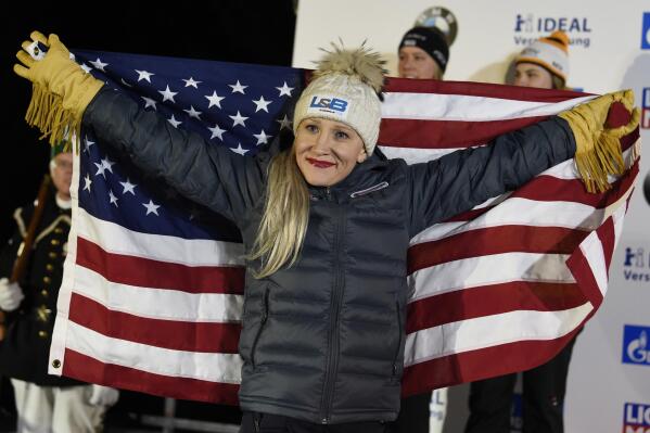FILE - Gold medalist Kaillie Humphries of the United States celebrates during the medal ceremony for the two-woman bobsled competition at the Bobsleigh and Skeleton World Championships in Altenberg, Germany, in this Saturday, Feb. 22, 2020, file photo. The U.S. Olympic and Paralympic Committee said Tuesday, Oct. 19, 2021, that it is still trying to help world champion bobsledder Kaillie Humphries obtain a way to compete in this winter's Beijing Games. (AP Photo/Jens Meyer, File)