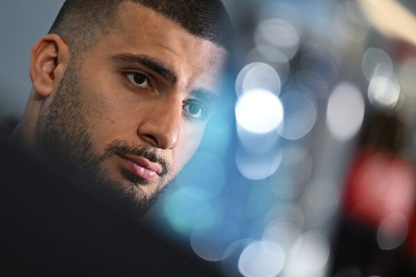 German soccer player Deniz Undav attends a press conference before the international match between France and Germany, at the DFB Campus in Frankfurt, Germany, Thursday March 21, 2024. (Arne Dedert/dpa via AP)