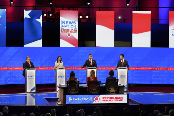 Republican presidential candidates from left, former New Jersey Gov. Chris Christie, former U.N. Ambassador Nikki Haley, Florida Gov. Ron DeSantis, and businessman Vivek Ramaswamy during a Republican presidential primary debate hosted by NewsNation on Wednesday, Dec. 6, 2023, at the Moody Music Hall at the University of Alabama in Tuscaloosa, Ala. (AP Photo/Gerald Herbert)