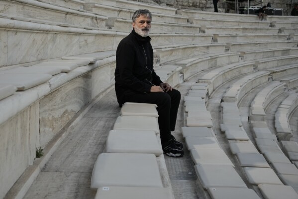 Greek National Opera's Artistic Director, Giorgos Koumendakis poses ahead of the dress rehearsal of Giacomo Puccini's "Turandot" by the Greek National Opera during the 70th Athens Epidaurus Festival in Athens, Greece, Friday, May 30, 2025. (AP Photo/Thanassis Stavrakis)